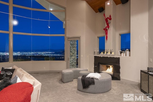 4020 Cocopah Ct, Reno, NV 89511 - living room with carpet floors, high vaulted ceiling, a warm lit fireplace, and wood ceiling