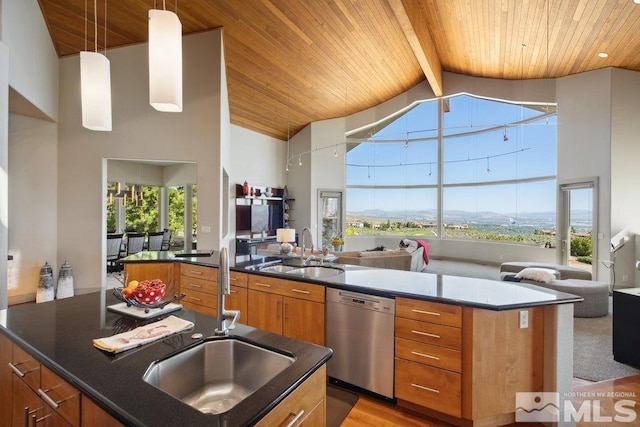 4020 Cocopah Ct, Reno, NV 89511 - kitchen with dishwasher, a wood ceiling with exposed beams, open floor plan, an island with sink, and brown cabinetry