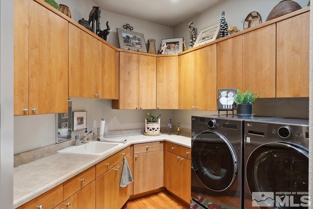 4020 Cocopah Ct, Reno, NV 89511 - laundry area with independent washer and dryer, cabinet space, and light wood-style floors