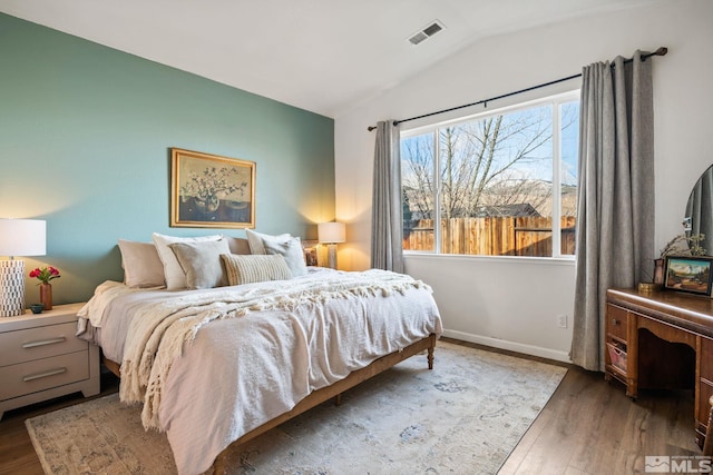 3550 Silverado, Carson City, NV 89705 - bedroom featuring lofted ceiling, wood finished floors, and baseboards