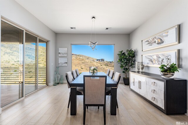 8956 Suncreek Trl, Reno, NV 89523 - dining area featuring a chandelier and light wood finished floors