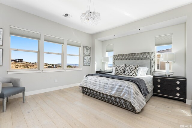 8956 Suncreek Trl, Reno, NV 89523 - bedroom with wood finished floors and a chandelier
