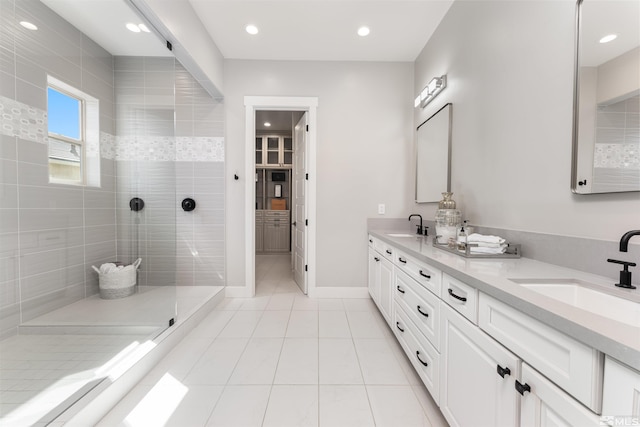 8956 Suncreek Trl, Reno, NV 89523 - bathroom featuring a walk in shower, tile patterned flooring, double vanity, and recessed lighting
