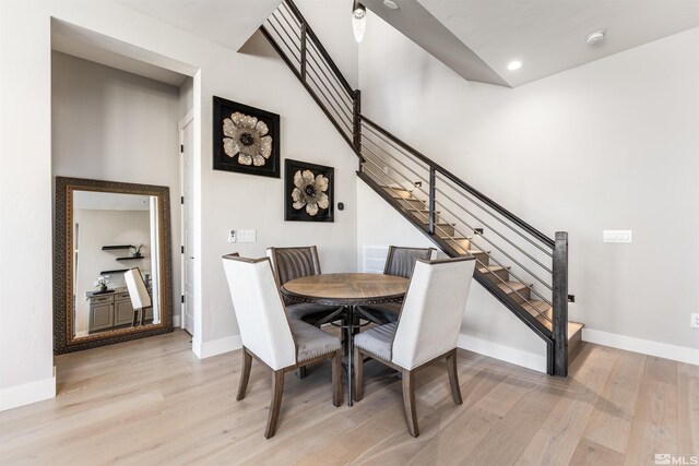 8956 Suncreek Trl, Reno, NV 89523 - dining area featuring light wood-style flooring, stairs, and recessed lighting