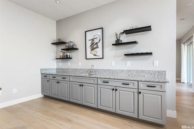 8956 Suncreek Trl, Reno, NV 89523 - indoor wet bar featuring light wood-style floors and baseboards