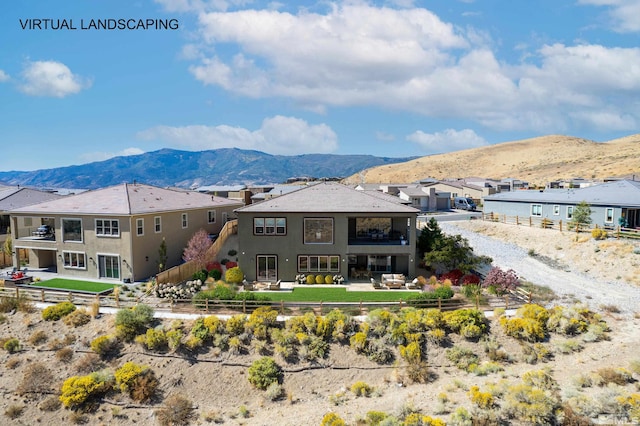 8956 Suncreek Trl, Reno, NV 89523 - rear view of house with a mountain view, a fenced backyard, stucco siding, a residential view, and a patio area
