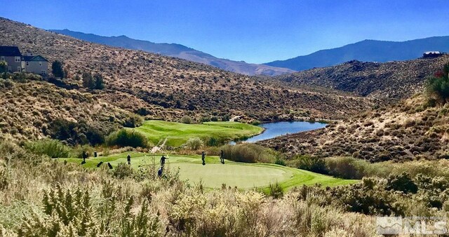8956 Suncreek Trl, Reno, NV 89523 - view of home's community with a water and mountain view