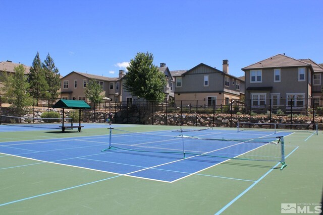 8956 Suncreek Trl, Reno, NV 89523 - view of tennis court with community basketball court and a residential view