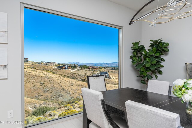 8956 Suncreek Trl, Reno, NV 89523 - dining area with a chandelier and a mountain view