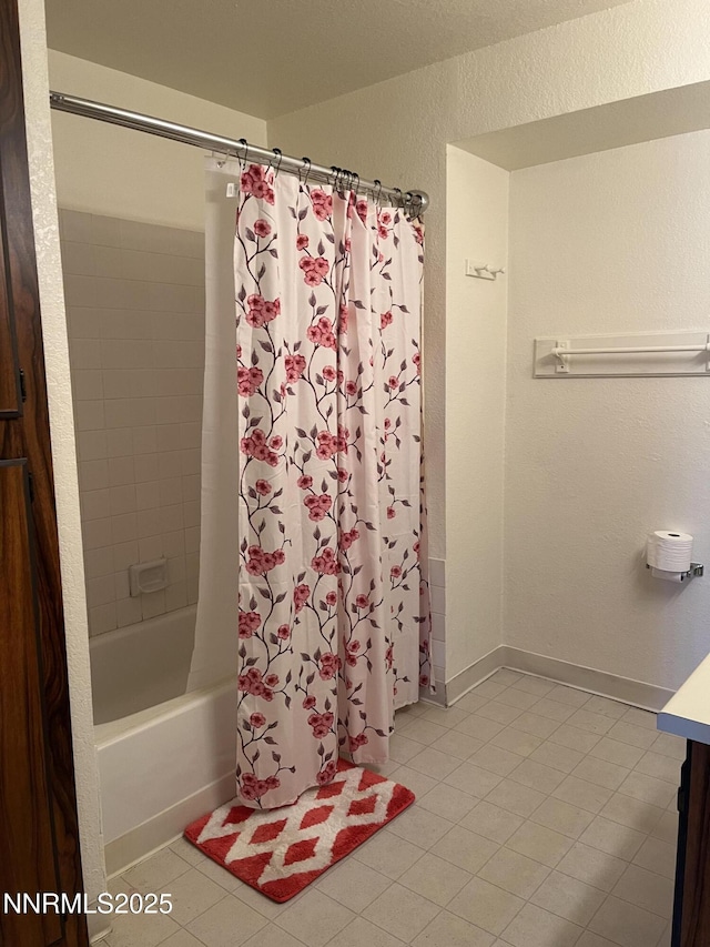 3865 E Leonesio Dr Unit B2, Reno, NV 89512 - bathroom featuring tile patterned floors, a textured wall, shower / bath combination with curtain, and vanity