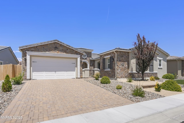 2313 Blushing Rock Dr, Reno, NV 89521 - ranch-style home with decorative driveway, stone siding, a garage, and stucco siding