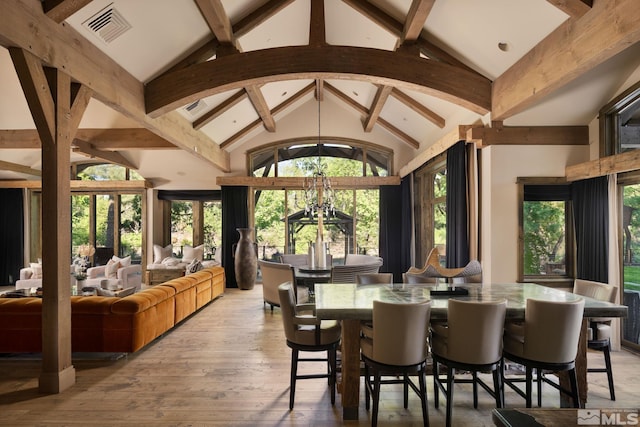 4000 Goodsell Ln, Reno, NV 89523 - dining room featuring beam ceiling, light wood-style flooring, high vaulted ceiling, and a chandelier