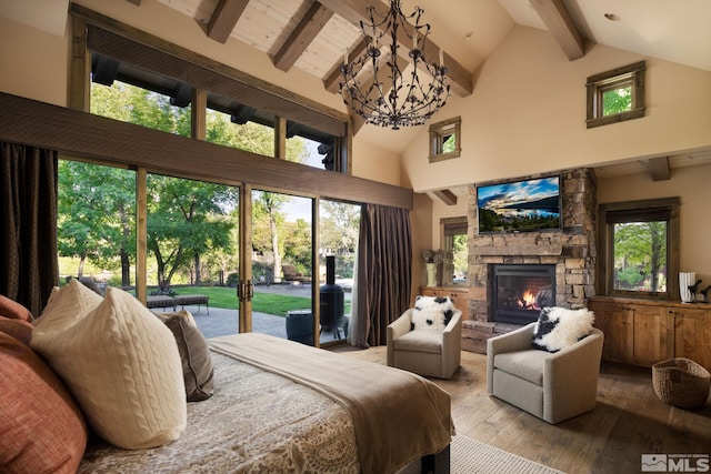4000 Goodsell Ln, Reno, NV 89523 - bedroom with access to exterior, high vaulted ceiling, hardwood / wood-style flooring, beamed ceiling, and a stone fireplace