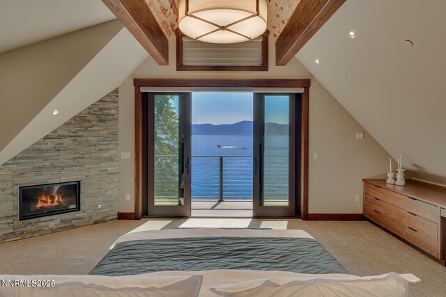 4250 N Lake Blvd, Carnelian Bay, CA 96140 - carpeted bedroom featuring access to exterior, a mountain view, and a stone fireplace