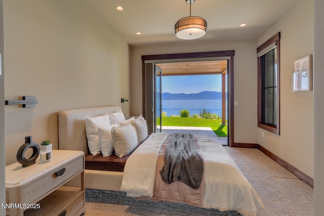 4250 N Lake Blvd, Carnelian Bay, CA 96140 - bedroom with access to exterior, light colored carpet, a water and mountain view, and recessed lighting