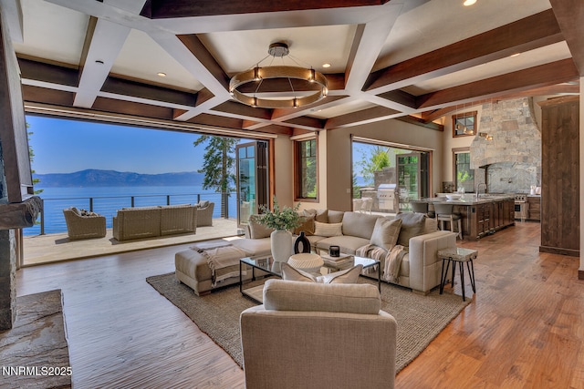 4250 N Lake Blvd, Carnelian Bay, CA 96140 - living room featuring beam ceiling, wood finished floors, recessed lighting, a water and mountain view, and coffered ceiling