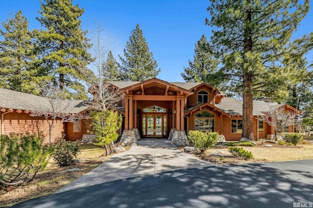 210 Sheridan Creek Ct, Gardnerville, NV 89460 - view of front facade with french doors and stone siding