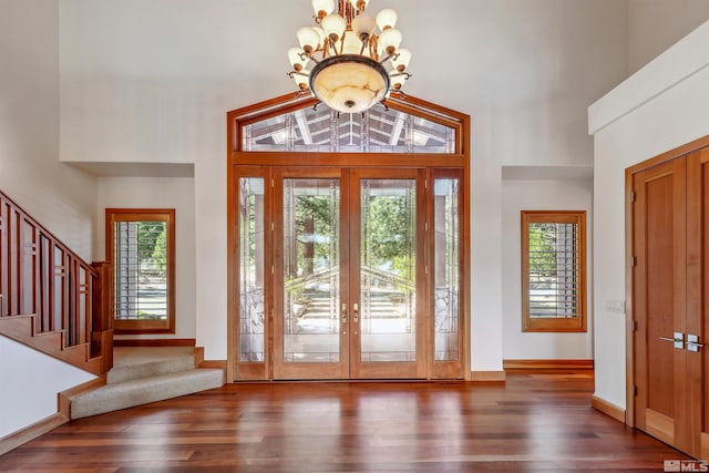 210 Sheridan Creek Ct, Gardnerville, NV 89460 - entrance foyer featuring plenty of natural light, french doors, wood finished floors, stairway, and a high ceiling
