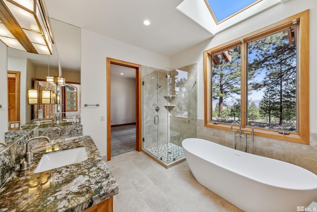 210 Sheridan Creek Ct, Gardnerville, NV 89460 - bathroom featuring a shower stall, a freestanding tub, vanity, healthy amount of natural light, and recessed lighting