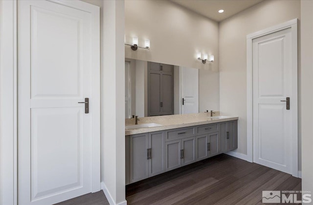 1223 Golden Eagle Ct, Gardnerville, NV 89410 - full bathroom featuring wood finished floors, baseboards, double vanity, and recessed lighting