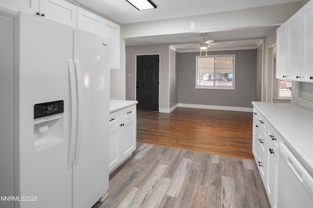 1600 Duke Way, Reno, NV 89502 - kitchen featuring white appliances, baseboards, light countertops, and white cabinets