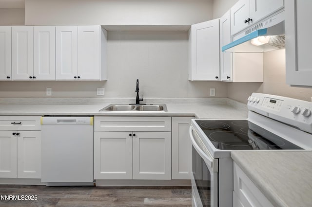 1600 Duke Way, Reno, NV 89502 - kitchen with white appliances, a sink, under cabinet range hood, and white cabinets