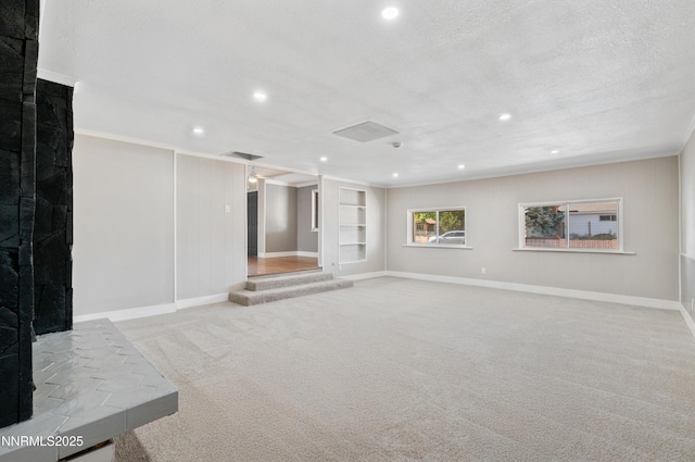 1600 Duke Way, Reno, NV 89502 - basement featuring carpet flooring, recessed lighting, baseboards, a textured ceiling, and built in shelves