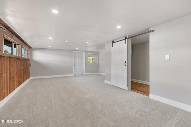 1600 Duke Way, Reno, NV 89502 - spare room featuring a barn door, light carpet, recessed lighting, and baseboards