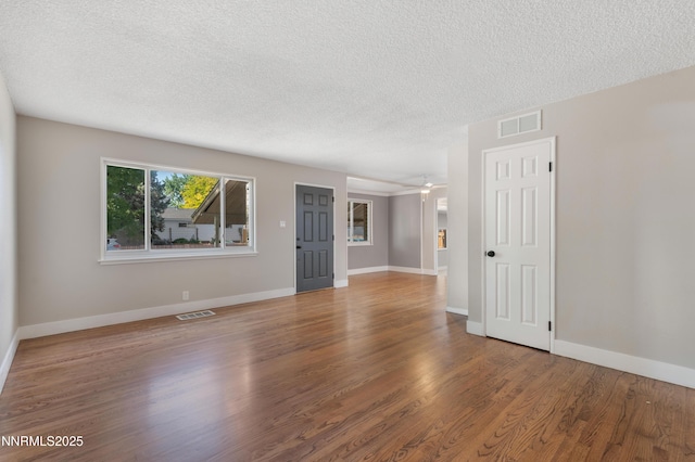 1600 Duke Way, Reno, NV 89502 - unfurnished room featuring a textured ceiling, wood finished floors, and baseboards