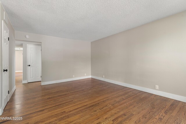 1600 Duke Way, Reno, NV 89502 - unfurnished room featuring dark wood finished floors, a textured ceiling, and baseboards