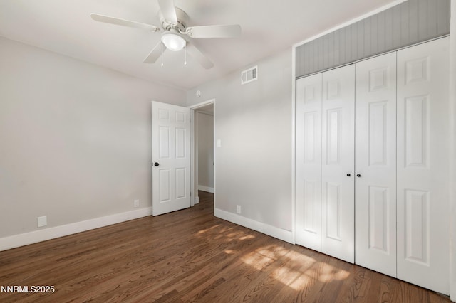 1600 Duke Way, Reno, NV 89502 - unfurnished bedroom featuring baseboards, wood finished floors, a closet, and a ceiling fan