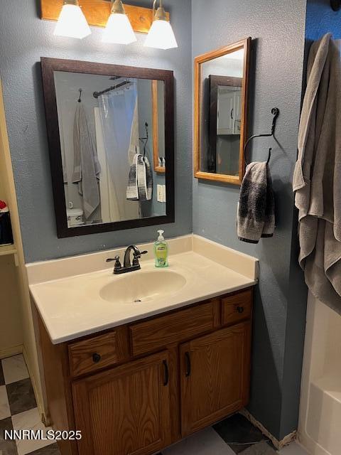 3860 Edwards Ln, Fallon, NV 89406 - bathroom with vanity, a shower with curtain, and a tub