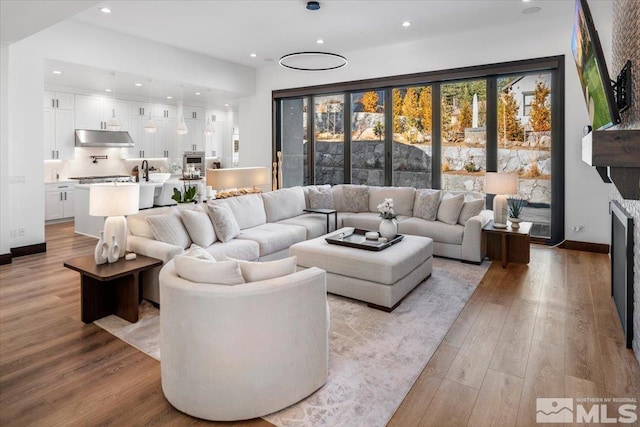20765 Parc Foret Dr, Reno, NV 89511 - living area with light wood finished floors, recessed lighting, and baseboards
