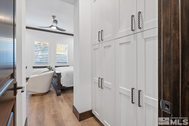 20765 Parc Foret Dr, Reno, NV 89511 - corridor with light wood finished floors, ornamental molding, and baseboards