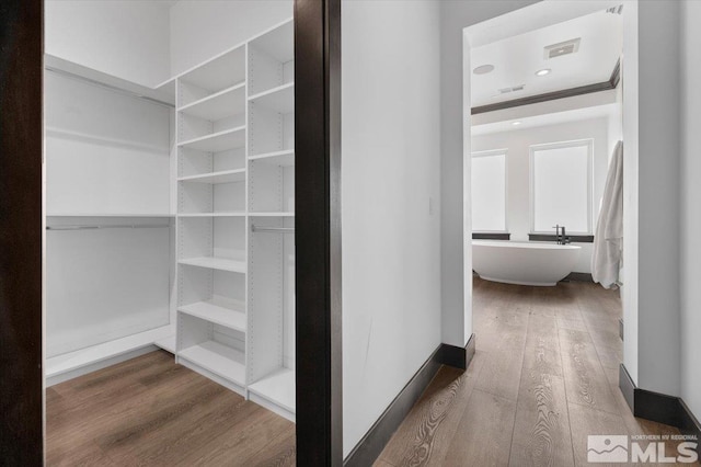 20765 Parc Foret Dr, Reno, NV 89511 - corridor with wood finished floors and baseboards