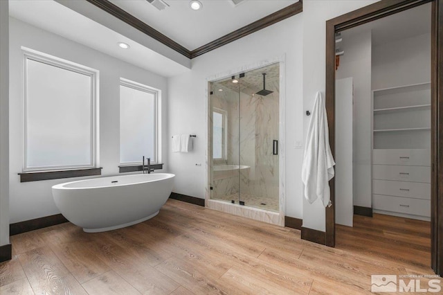 20765 Parc Foret Dr, Reno, NV 89511 - full bath with crown molding, a marble finish shower, baseboards, wood finished floors, and a soaking tub