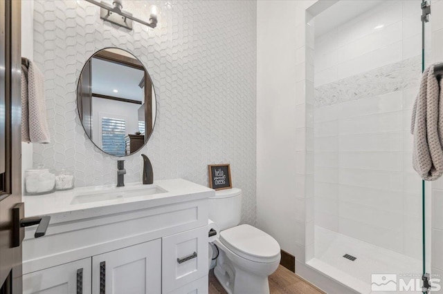 20765 Parc Foret Dr, Reno, NV 89511 - bathroom with toilet, vanity, wood finished floors, and tiled shower