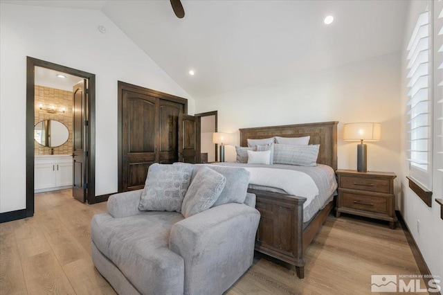 20765 Parc Foret Dr, Reno, NV 89511 - bedroom with light wood finished floors, multiple windows, ensuite bath, baseboards, and recessed lighting