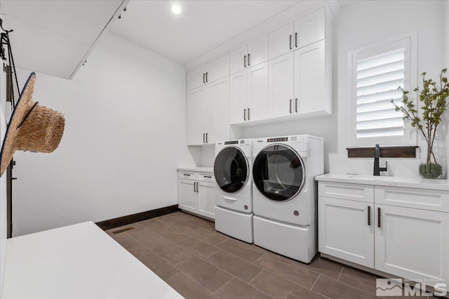 20765 Parc Foret Dr, Reno, NV 89511 - laundry area with cabinet space, independent washer and dryer, and baseboards
