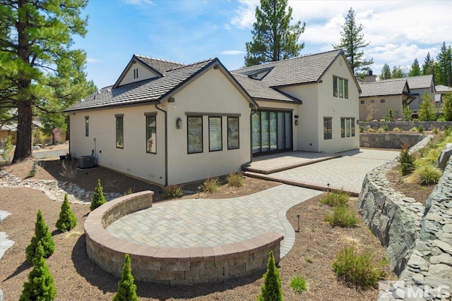 20765 Parc Foret Dr, Reno, NV 89511 - rear view of property with a patio area, stucco siding, and central AC