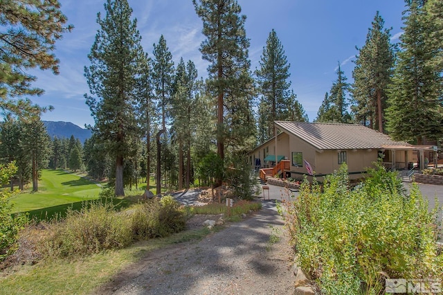 931 Incline Way Unit 249Mccloud, Incline Village, NV 89451 - view of home's exterior with metal roof, a deck with mountain view, and a standing seam roof
