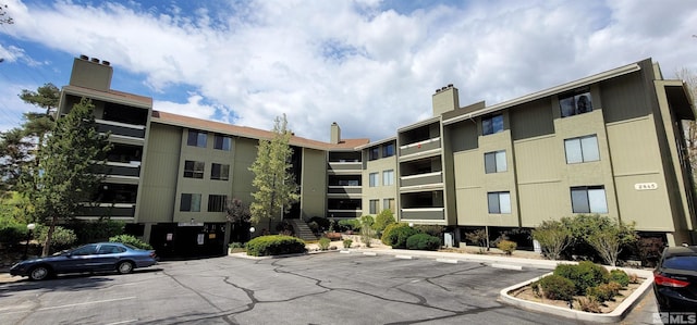 2845 Idlewild Dr Unit 303, Reno, NV 89509 - view of apartment building / complex with uncovered parking