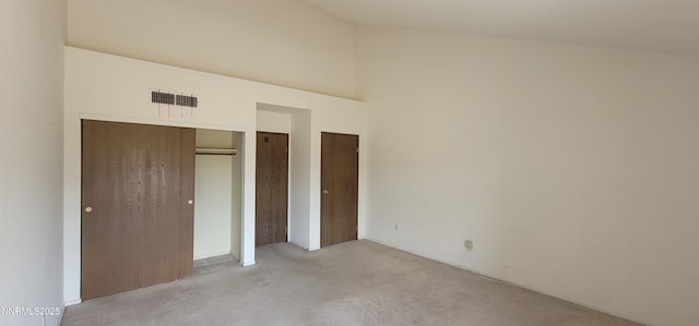 2845 Idlewild Dr Unit 303, Reno, NV 89509 - unfurnished bedroom with light colored carpet and high vaulted ceiling
