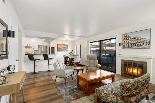 2445 Sycamore Glen Dr Unit 6, Sparks, NV 89434 - living area featuring wood finished floors and a glass covered fireplace