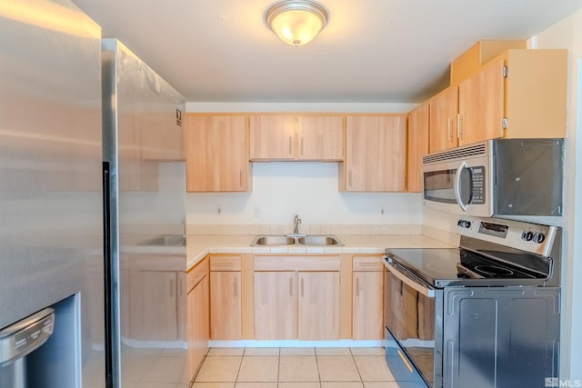 1640 Gault Way, Sparks, NV 89431 - kitchen featuring stainless steel appliances, a sink, light brown cabinets, light tile patterned floors, and tile counters
