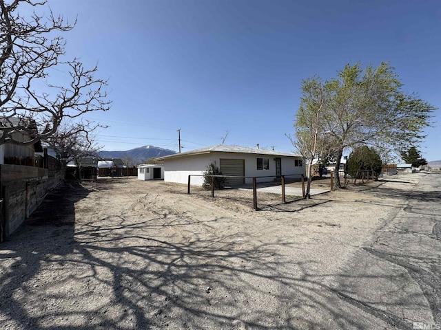 309 M St, Hawthorne, NV 89415 - back of property featuring fence and a mountain view