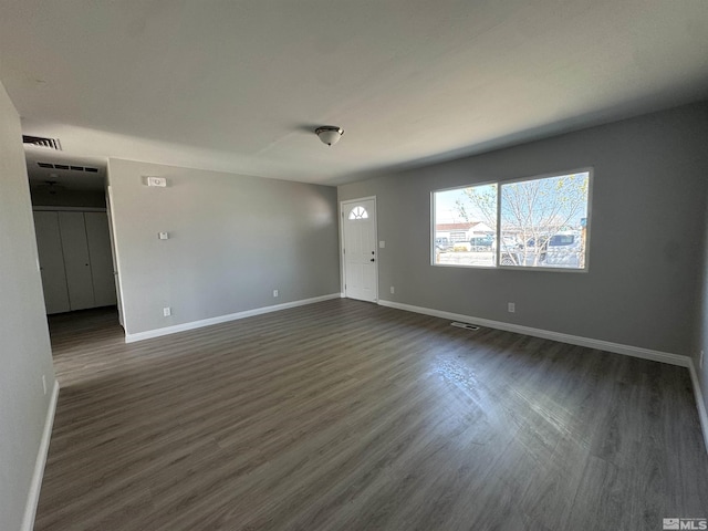 309 M St, Hawthorne, NV 89415 - unfurnished living room with baseboards and dark wood finished floors