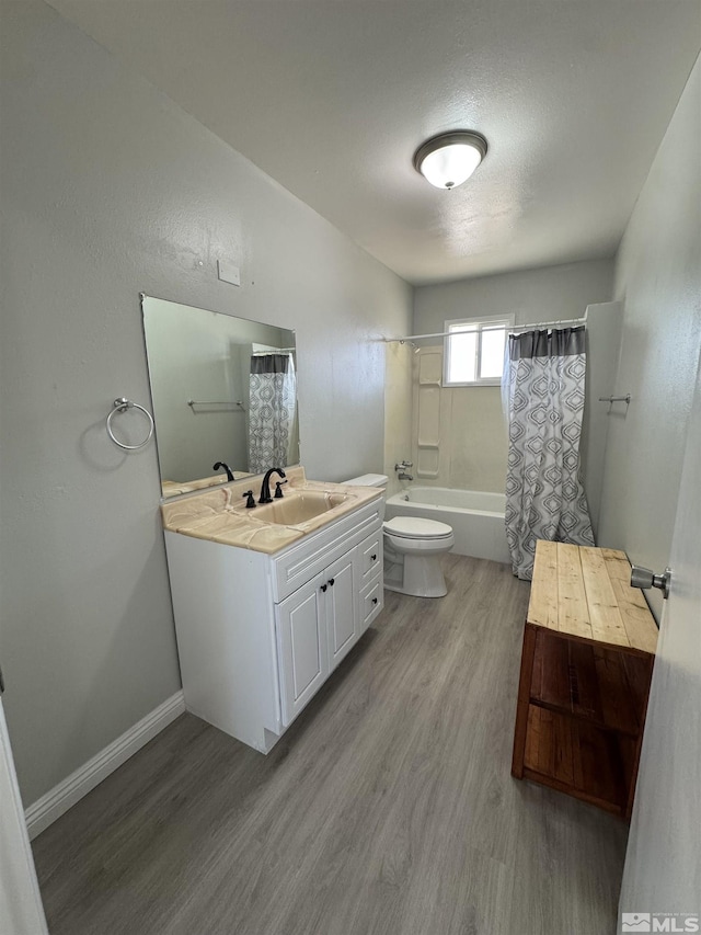 309 M St, Hawthorne, NV 89415 - full bath with wood finished floors, vanity, toilet, and shower / tub combo