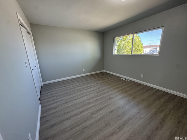309 M St, Hawthorne, NV 89415 - unfurnished bedroom featuring baseboards, wood finished floors, and a closet