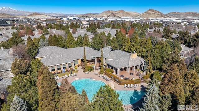 900 S Meadows Pkwy Unit 3522, Reno, NV 89521 - aerial view of property and surrounding area with a pool, mountains, and nearby suburban area